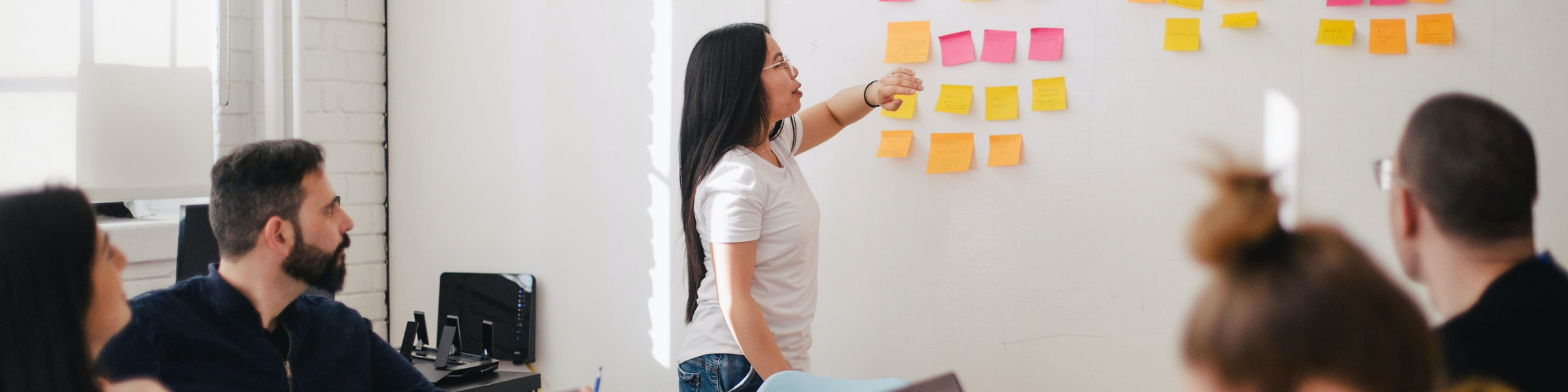 DfT Communications professional conducting a whiteboard presentation.