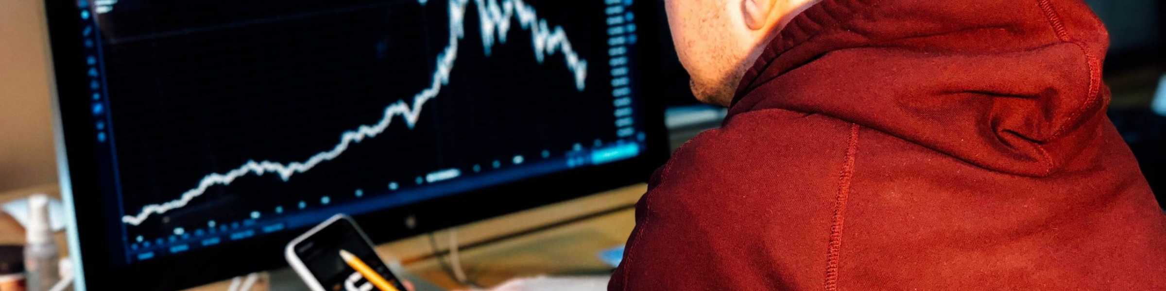 DfT economist analysing a graph on screen.