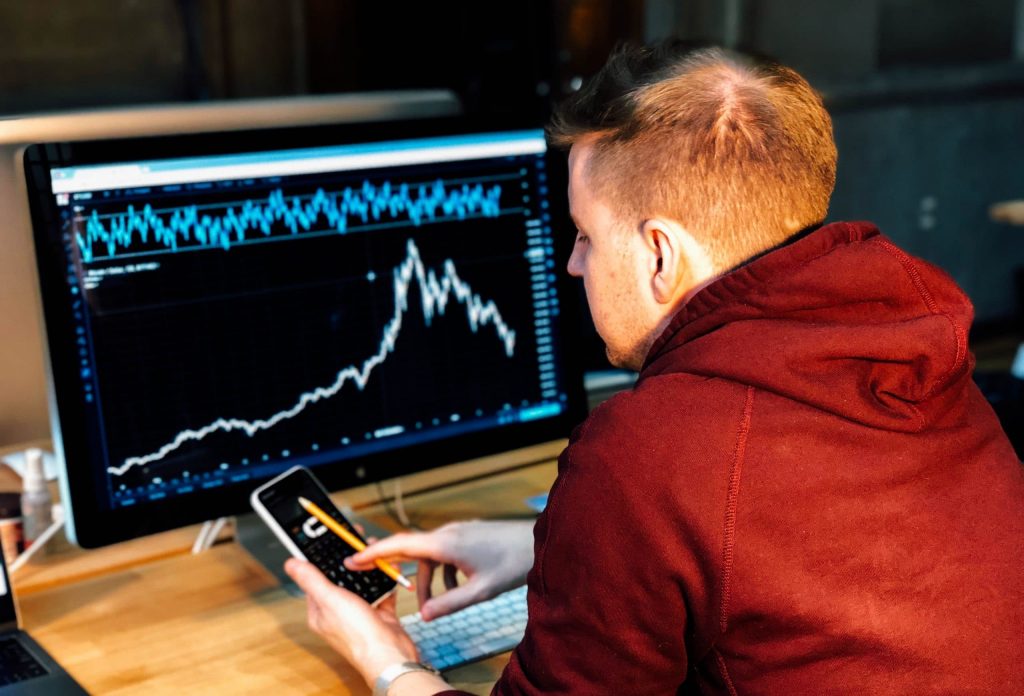 DfT economist analysing a graph on screen.