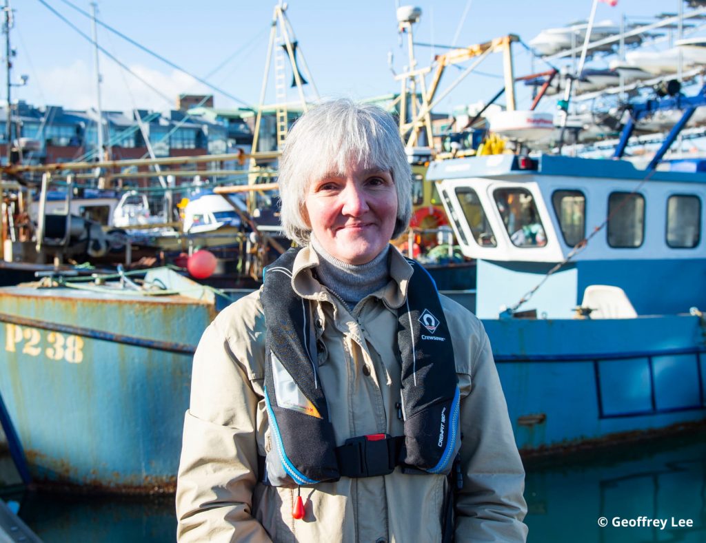 Female MCA worker at the coast