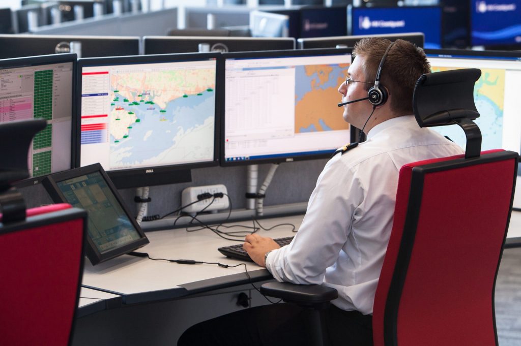 Male coastguard at work at the office.