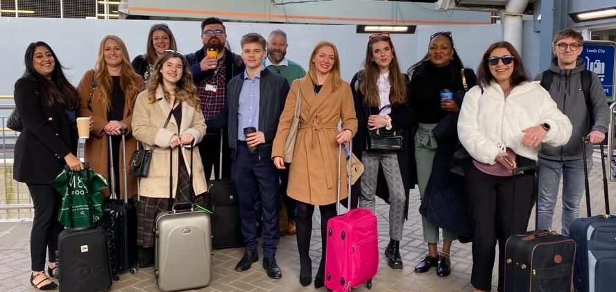 Group photo of Leeds City College students at the train station ready to travel to DfT's office in London.